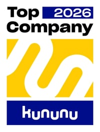Siegel mit Schriftzug „kununu Top Company 2026" in Blau und Gelb.